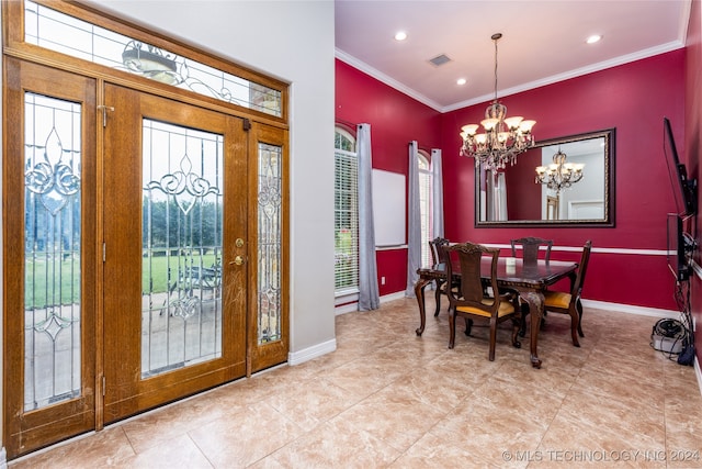 dining area featuring crown molding, a notable chandelier, and light tile patterned floors