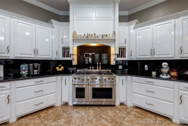 kitchen featuring range with two ovens and white cabinets