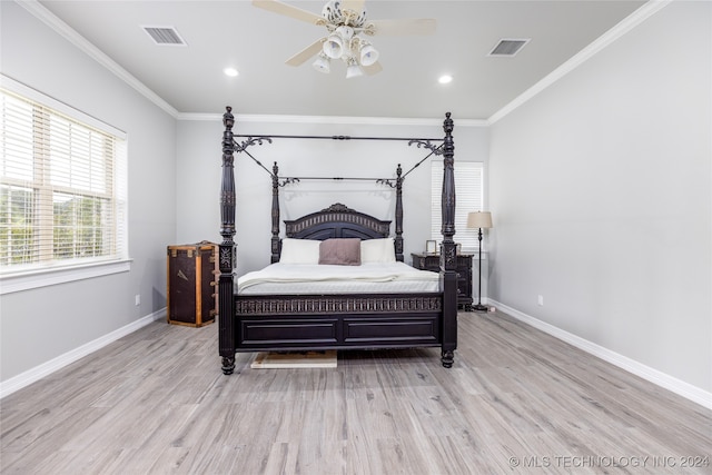 bedroom featuring ornamental molding, ceiling fan, and light hardwood / wood-style floors