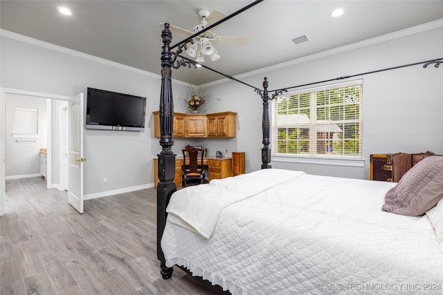 bedroom with ceiling fan, connected bathroom, crown molding, and light hardwood / wood-style flooring