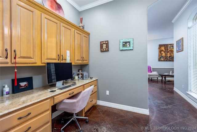 home office with dark tile patterned flooring, baseboards, ornamental molding, and built in study area