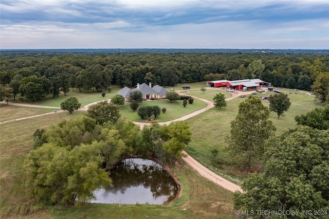 drone / aerial view featuring a rural view and a water view