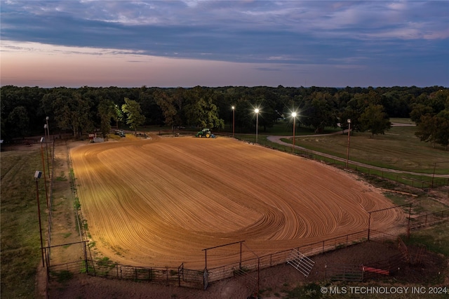aerial view at dusk featuring a rural view