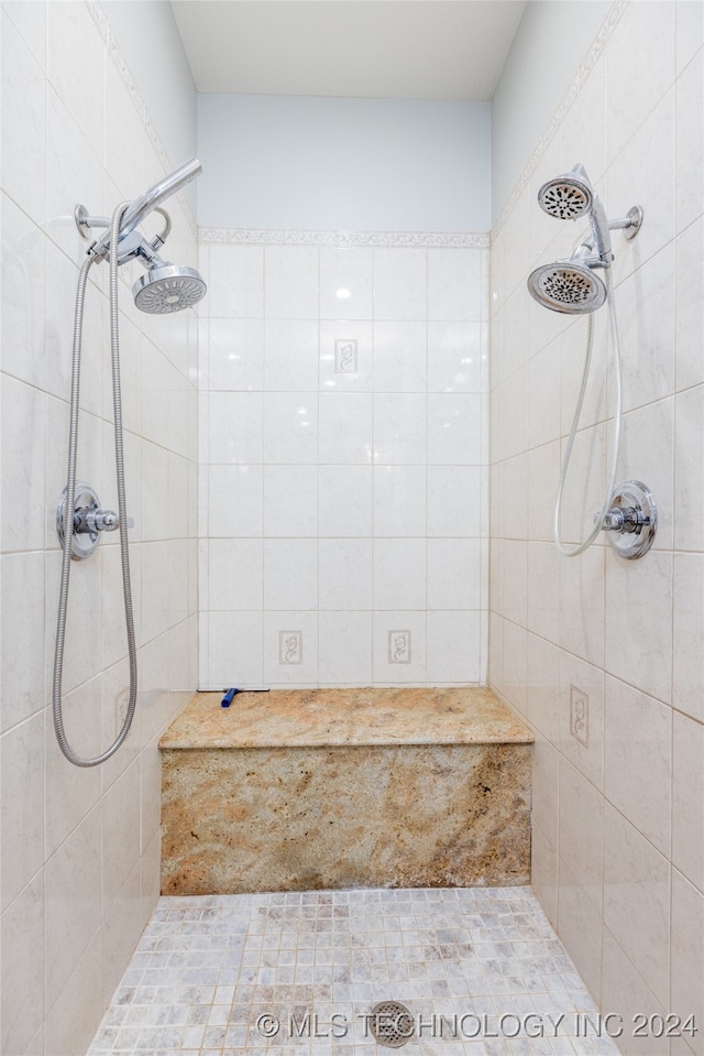 bathroom with a tile shower