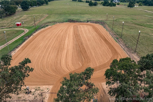 birds eye view of property with a rural view
