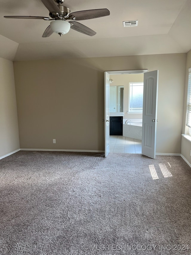 carpeted empty room with ceiling fan