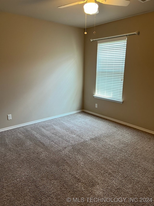 carpeted empty room with ceiling fan