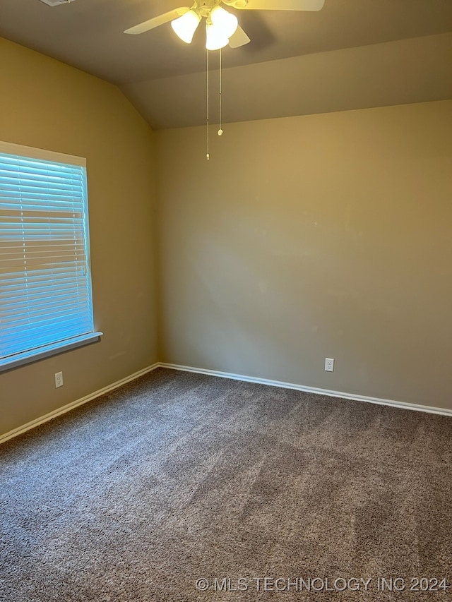 unfurnished room with lofted ceiling, carpet, and ceiling fan