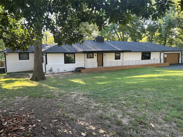 view of front facade featuring a front lawn and central AC unit