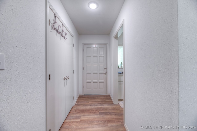 hall with light wood-type flooring