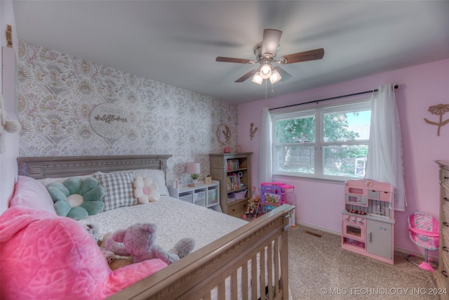 bedroom featuring ceiling fan and light carpet