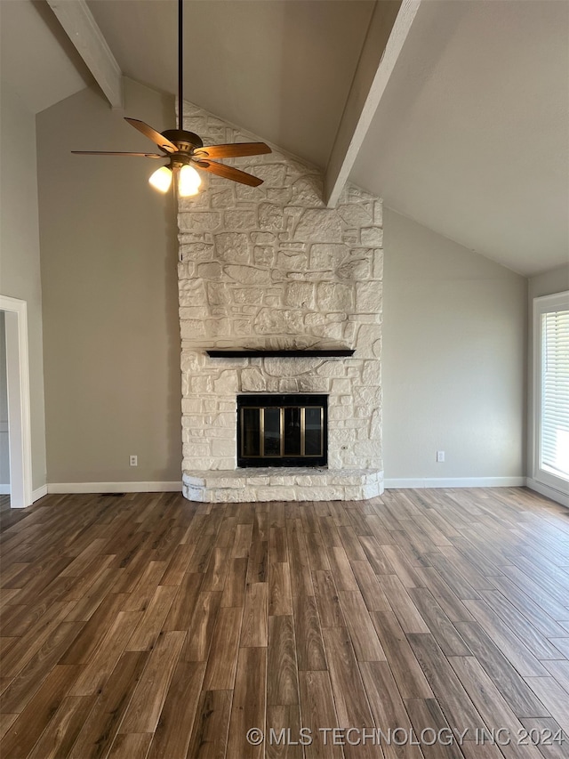 unfurnished living room with ceiling fan, a fireplace, wood-type flooring, and vaulted ceiling with beams