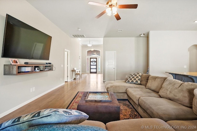 living room with ceiling fan and wood-type flooring