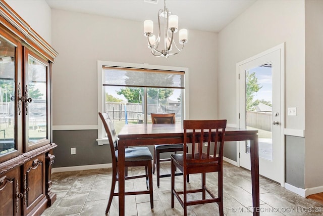 dining room featuring a chandelier and plenty of natural light