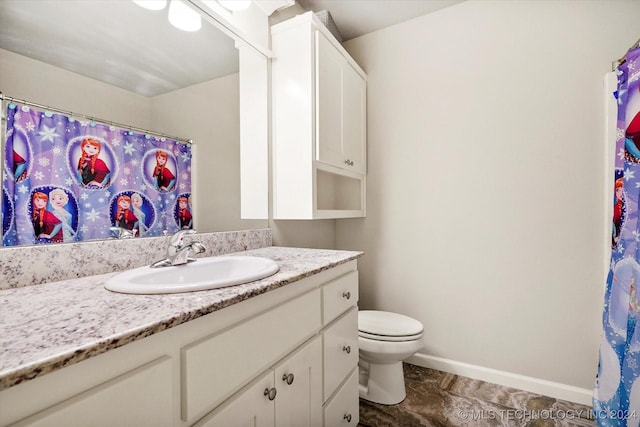 bathroom with vanity and toilet