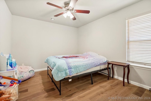 bedroom with hardwood / wood-style flooring and ceiling fan