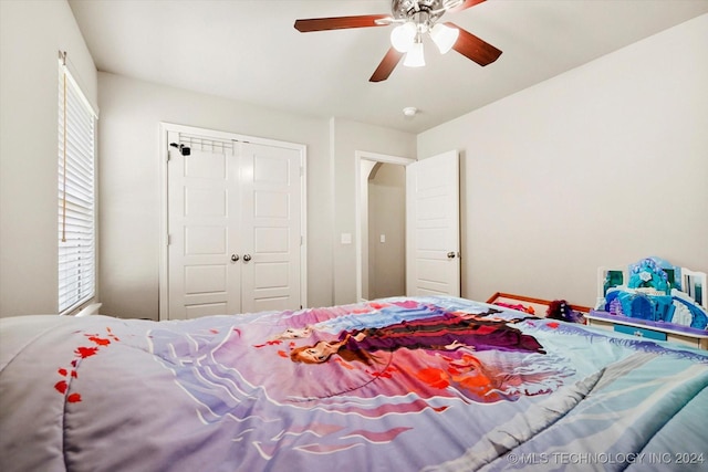 bedroom featuring a closet and ceiling fan