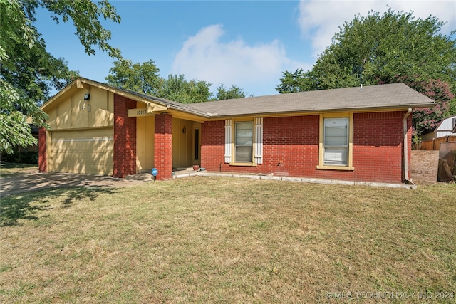 single story home with a garage and a front yard