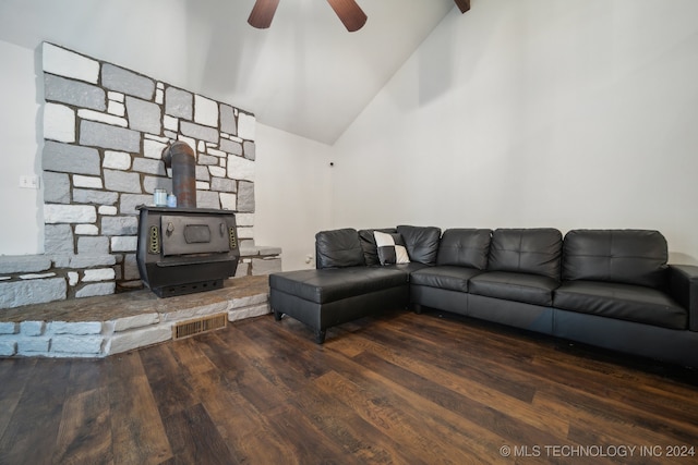 living room with beamed ceiling, ceiling fan, high vaulted ceiling, a wood stove, and dark hardwood / wood-style floors