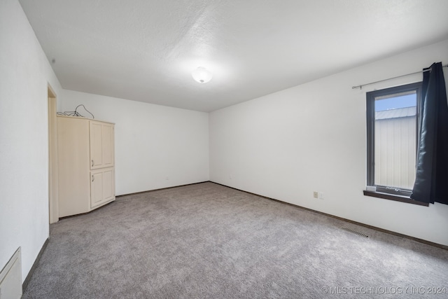 unfurnished room with carpet floors