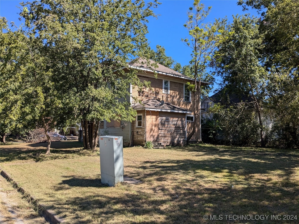 exterior space with a front lawn