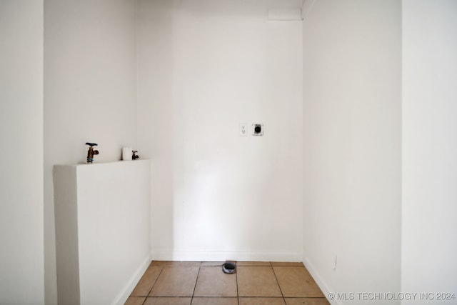 laundry room featuring light tile patterned floors and electric dryer hookup