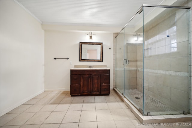 bathroom featuring a shower with shower door, tile patterned flooring, ornamental molding, and vanity