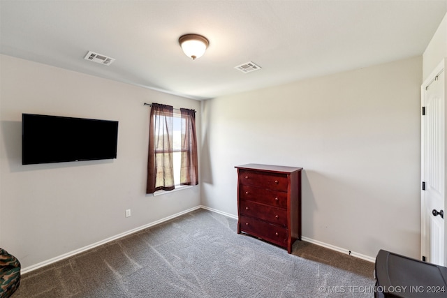 bedroom featuring dark carpet