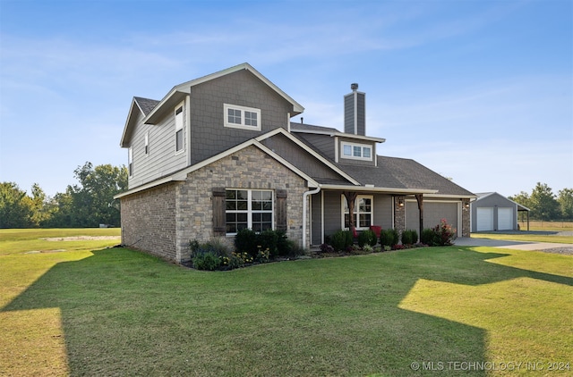 view of front of house with a garage and a front lawn