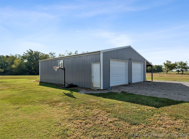 garage with wooden walls and a yard