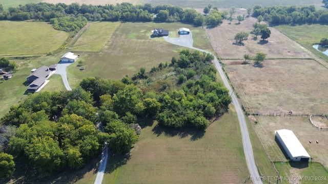 birds eye view of property with a rural view