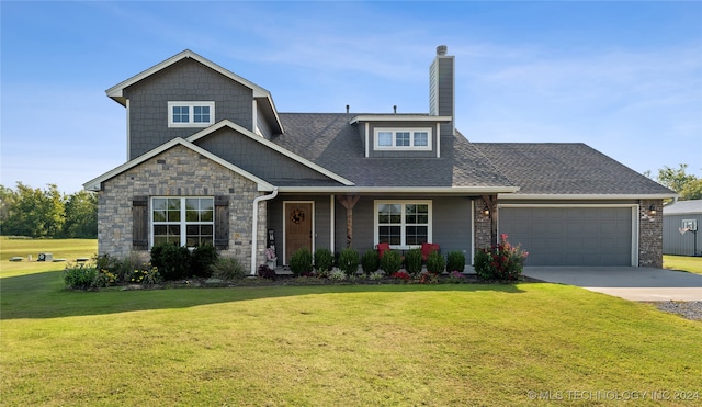 view of front facade featuring a front lawn and a garage