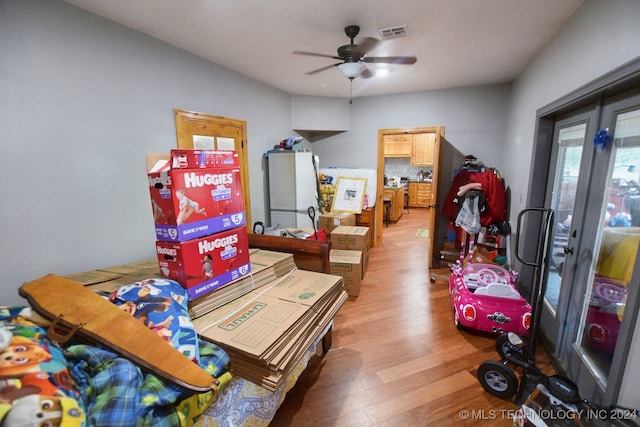 game room with ceiling fan and hardwood / wood-style floors