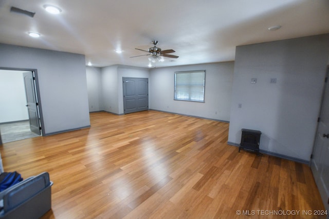 unfurnished living room featuring light wood-type flooring and ceiling fan