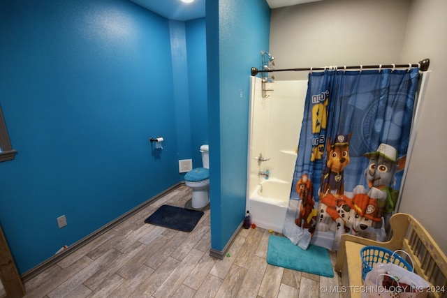 bathroom with toilet, shower / tub combo, and hardwood / wood-style flooring