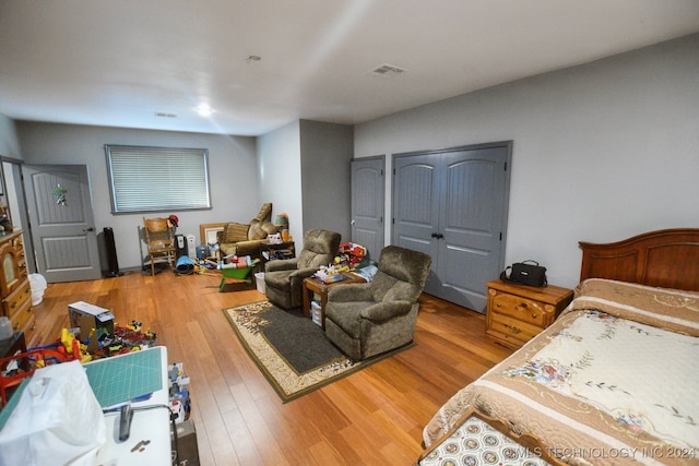 bedroom with hardwood / wood-style flooring