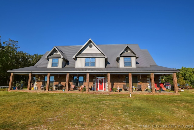 view of front of house with covered porch and a front yard