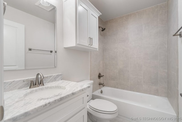 full bath featuring vanity, shower / tub combination, and toilet