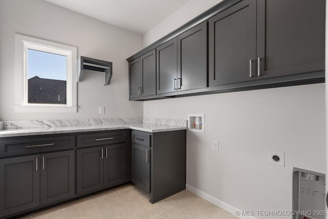 laundry area with cabinet space, hookup for a washing machine, baseboards, and electric dryer hookup