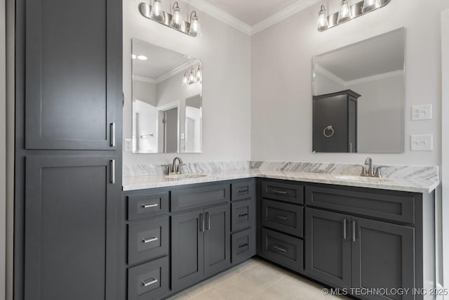 bathroom with double vanity, tile patterned flooring, a sink, and crown molding