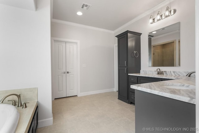 bathroom with visible vents, crown molding, vanity, and a garden tub