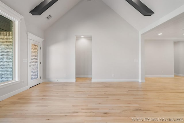 unfurnished room with recessed lighting, visible vents, light wood-style floors, high vaulted ceiling, and baseboards