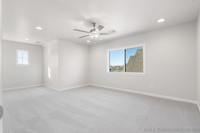 unfurnished room featuring recessed lighting, visible vents, baseboards, and light colored carpet