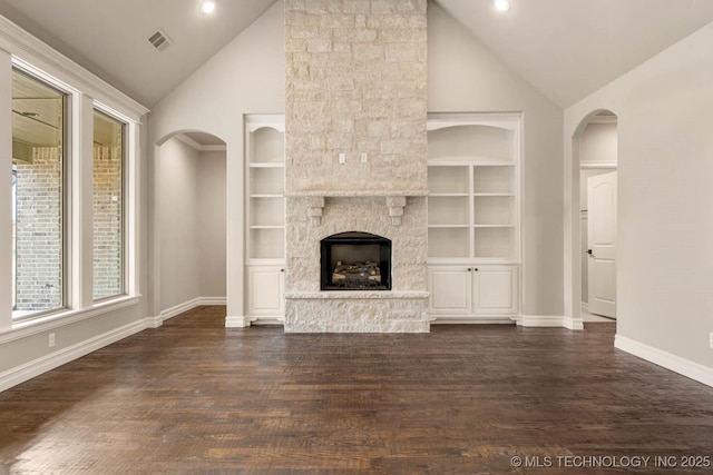 unfurnished living room with a fireplace, built in features, high vaulted ceiling, and dark hardwood / wood-style floors