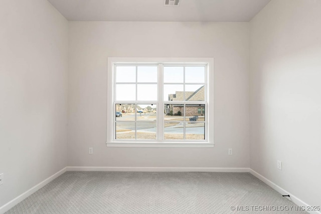 view of carpeted spare room