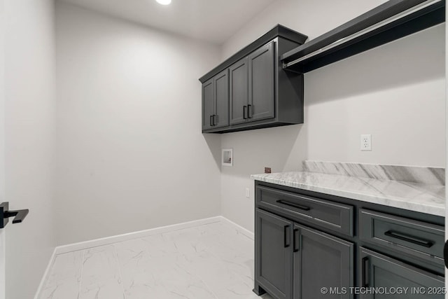 laundry area with cabinets and hookup for a washing machine