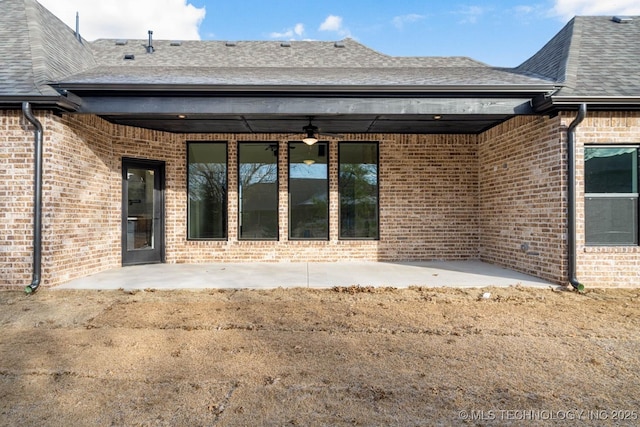 back of property with a patio area and ceiling fan