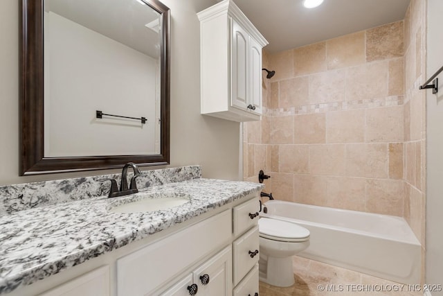 14504 E 80th St, Owasso, OK 74055 - full bath featuring tile patterned flooring, toilet, shower / bathtub combination, and vanity