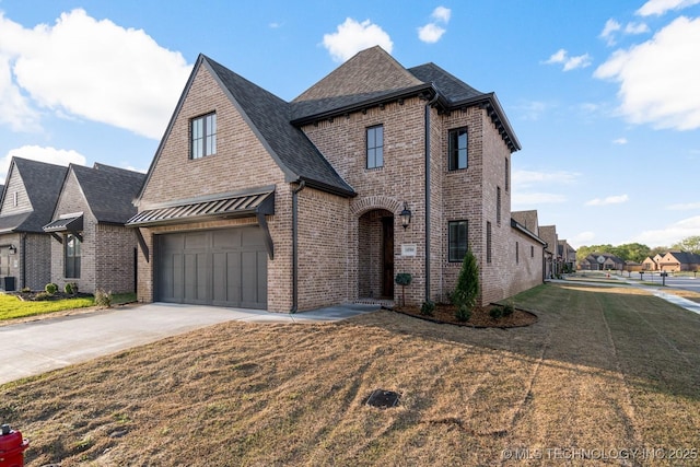 14504 E 80th St, Owasso, OK 74055 - view of front facade featuring brick siding, a front yard, roof with shingles, and concrete driveway