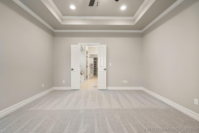 14504 E 80th St, Owasso, OK 74055 - empty room with ceiling fan, light carpet, a raised ceiling, baseboards, and ornamental molding